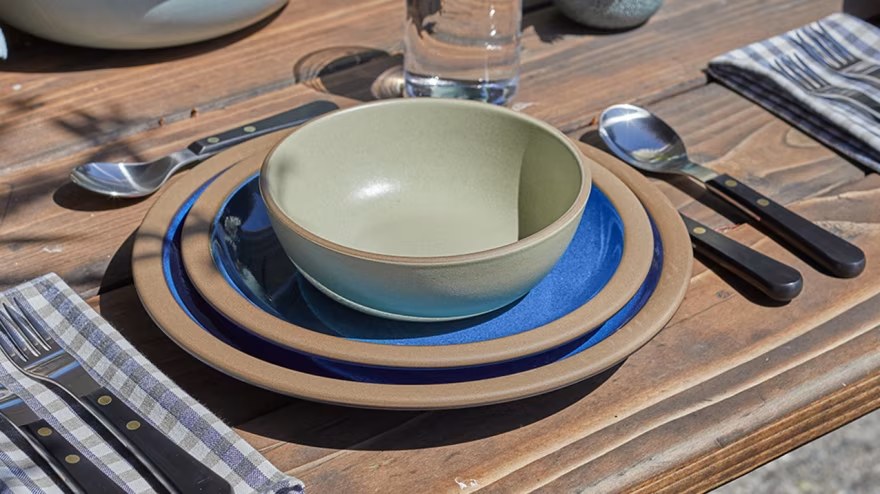 Heath place setting on a wood table