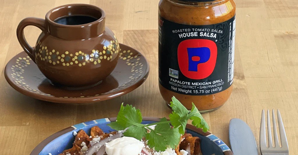 Chilaquiles and coffee with a jar of Papalote salsa